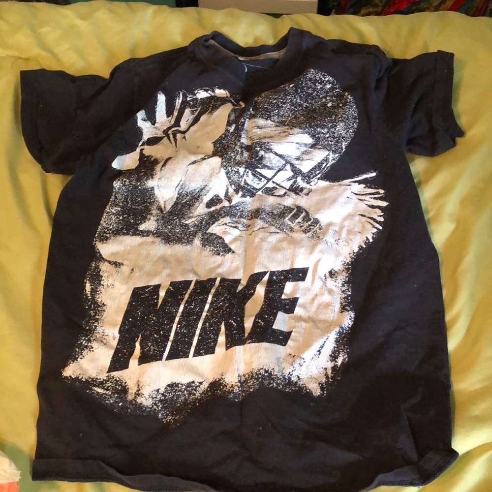 Black shirt with a football player